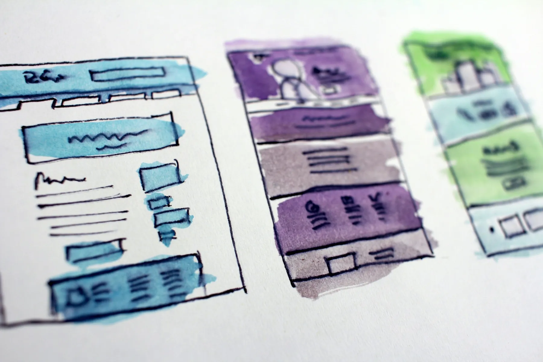 Hand-drawn watercolour wireframes of three website and app layouts