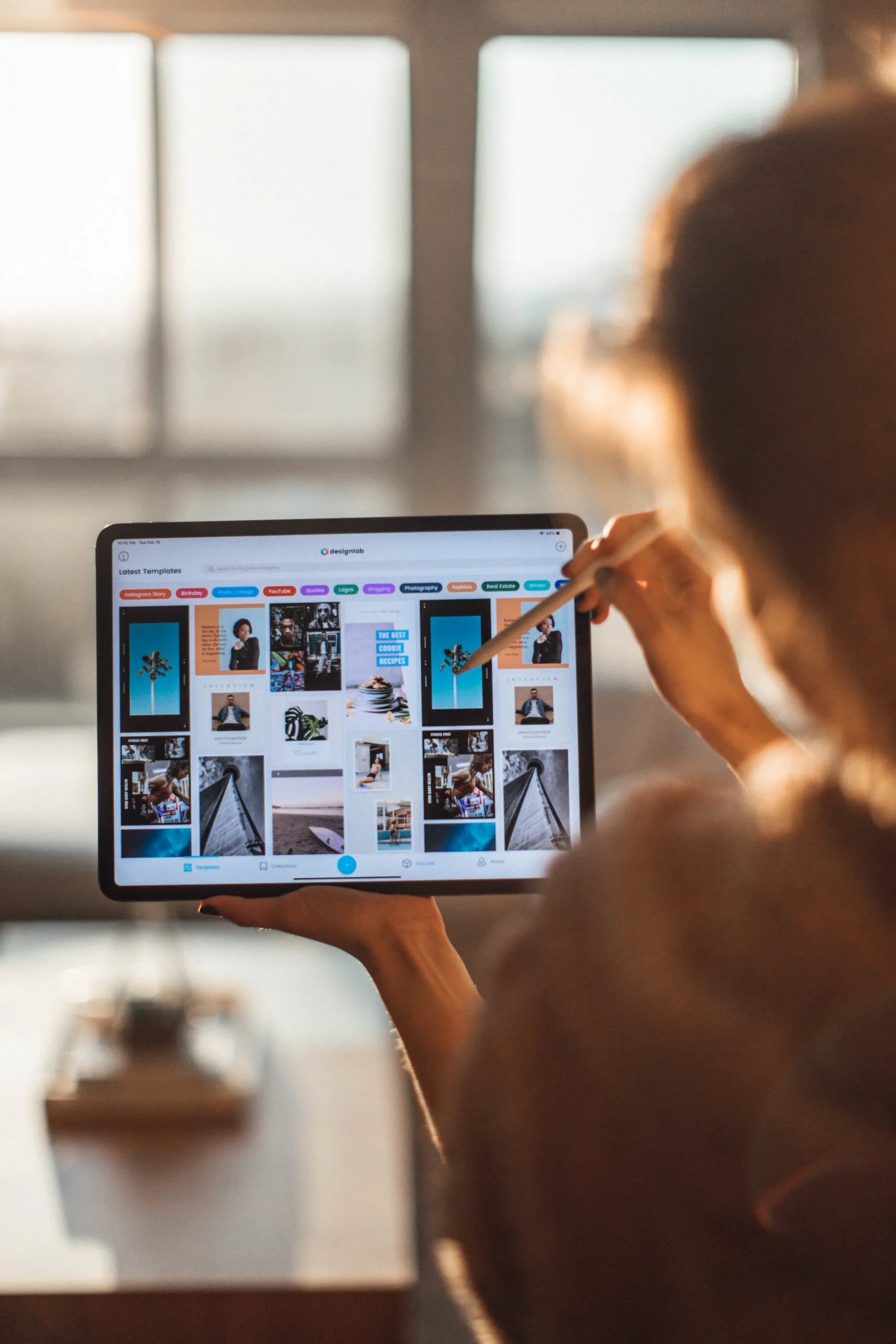 Reviewing a grid of social content templates on a tablet